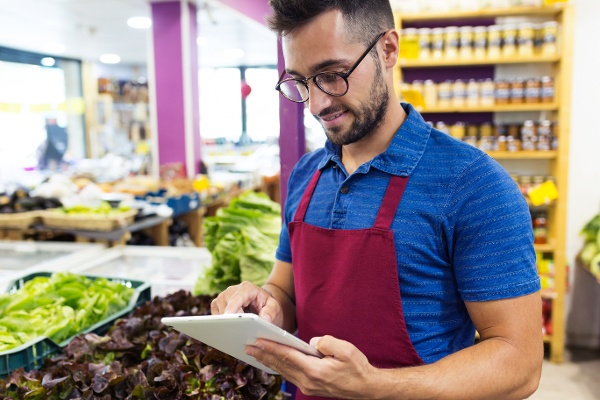 Man with tablet in grocery store-1